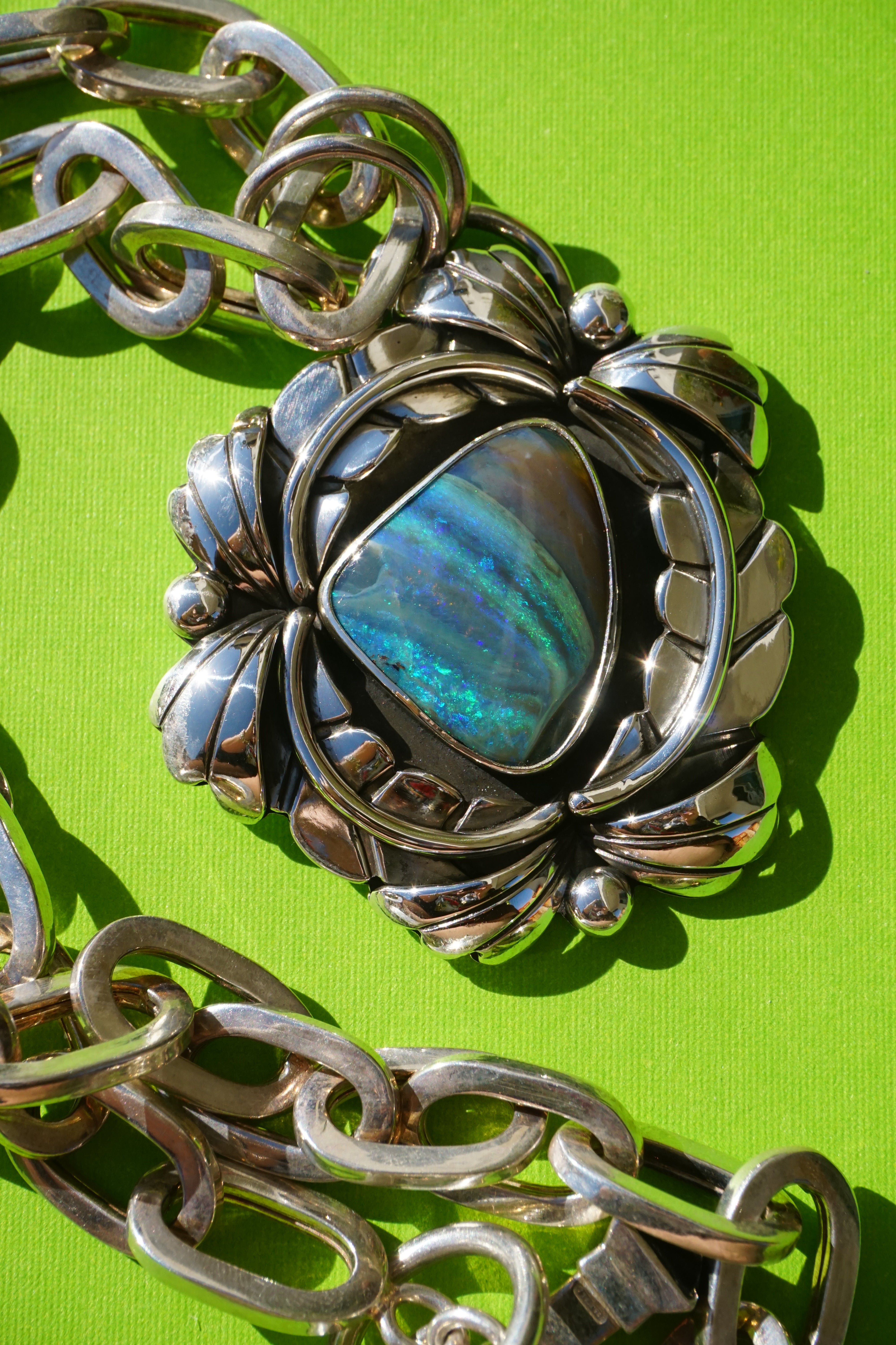 australian boulder opal leafy pendant with vintage paperclip chain.