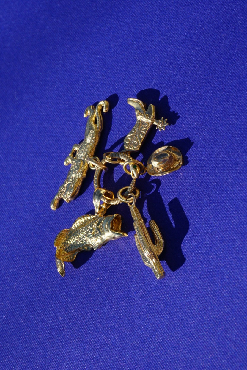 solid gold vintage charms.
