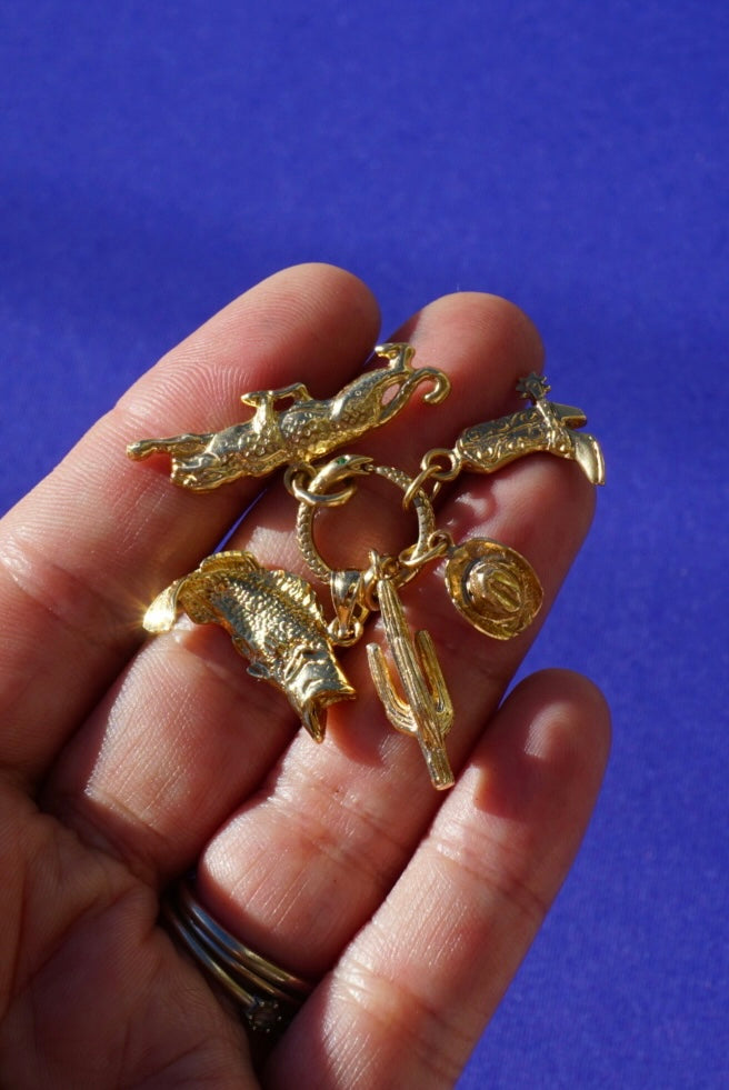 solid gold vintage charms.
