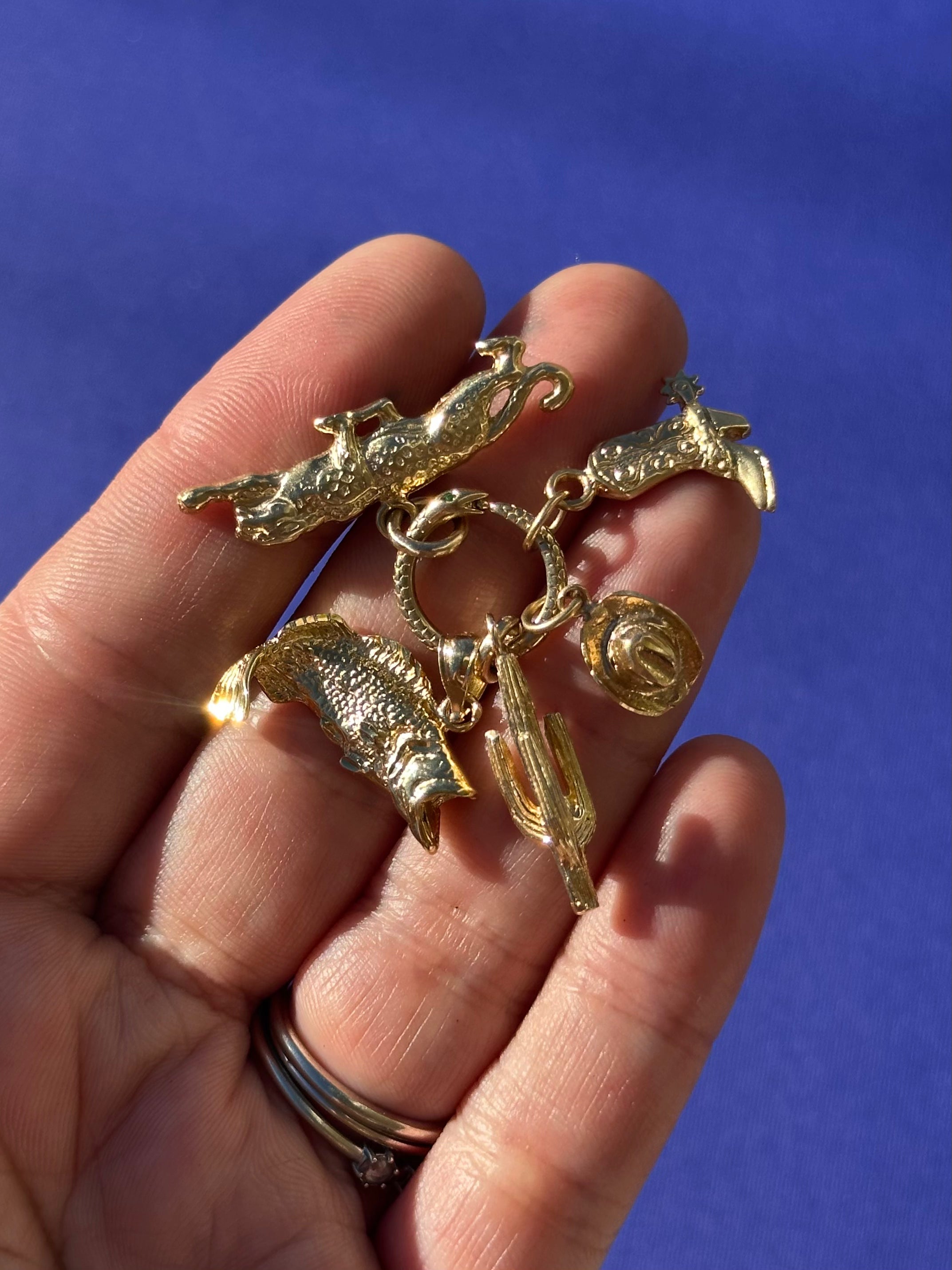 solid gold vintage charms.